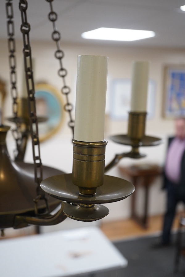 A French Empire style five light ceiling light in antique brass, early 20th century, wired, overall 68cm high, 48cm wide. Condition - fair to good, untested